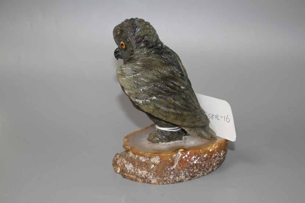 A carved labradorite model of an owl on an agate base, height 12.8cm.